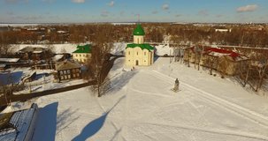 4K aerial video footage of Spaso-Preobrazenskiy (Transfiguration) Cathedral with domes and Pereslavl-Zalesski town center in Golden Ring route in winter time, north-eastern Russia, 160 km from Moscow