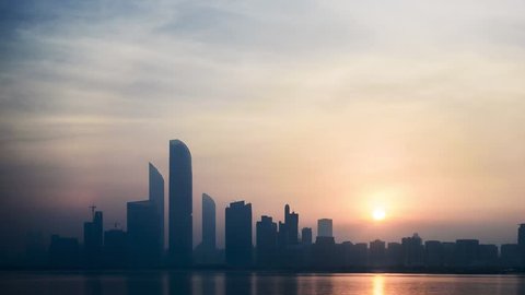 Abu Dhabi, United Arab Emirates - August 2017 - Sunrise over the Abu Dhabi Skyline