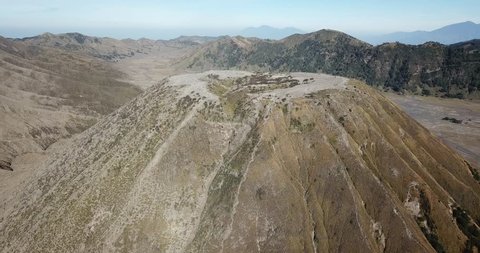 Mountain Bromo active volcano crater in East Jawa, Indonesia. Top view from drone fly. 4K footage