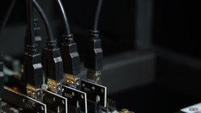 Connected MSI slots amid the flashing motherboard lights of a farm computer for bitcoin mining