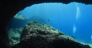 scuba divers underwater scenery