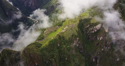 Machu Picchu Peru Aerial v3 Birdseye view flying over ancient ruins panning