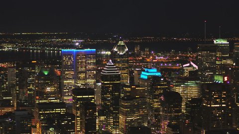 Montreal Quebec Aerial v32 Flying low across downtown at night with cityscape views 7/17