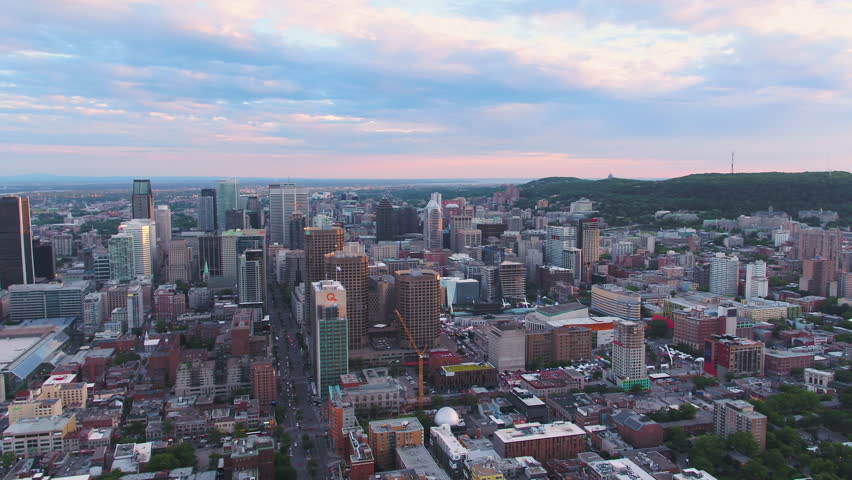 Montreal Quebec Aerial v70 Flying over downtown panning with cityscape views at sunset 7/17