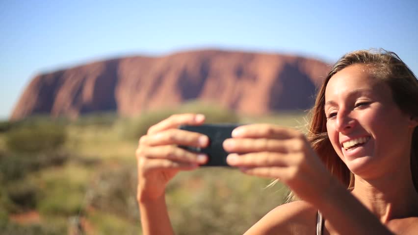 Caucasian female in Australia hiking takes a selfie portrait
Cheerful young woman in Australia hiking takes a selfie portrait using a mobile phone in the outback.