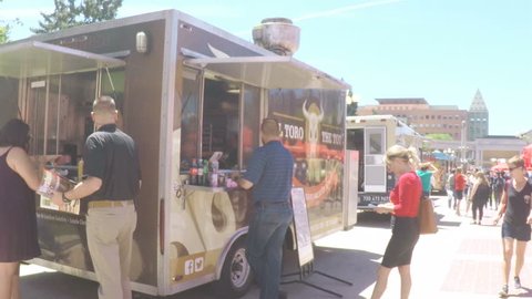 Denver, Colorado, USA-June 15, 2017.  POV point of view - Lunch time gathering of gourmet food trucks at the Civic Center Park.