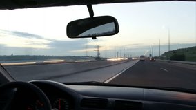 Point of view. Driving at sunset / dusk Time-Lapse. Highway.