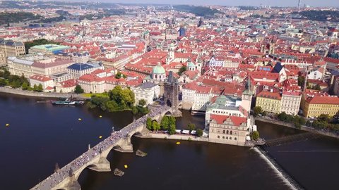 Aerial footage of Prague, Czech Republic, on a beautiful summer's day over Charles Bridge and Prague one municipal district.
