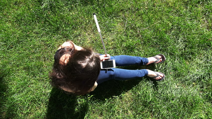 a young girl browsing photos on an advanced smartphone.