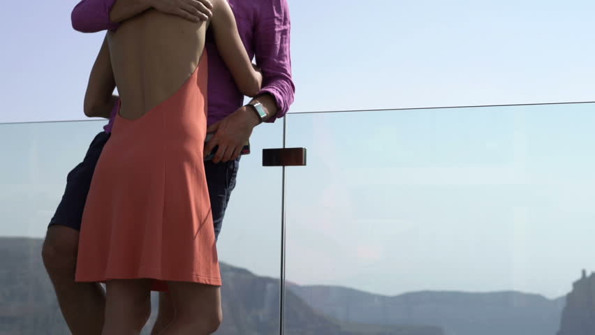 Young couple saying goodbye, breaking up on terrace 
