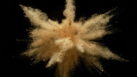 Colorful powder/particles fly after being exploded against black background. Shot with high speed camera, phantom flex 4K. Slow Motion. Unedited version is included at the end of clip.