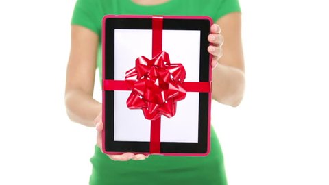 Tablet PC gift. Closeup of woman showing and giving digital tablet computer as present or christmas gift. Pure white background.
