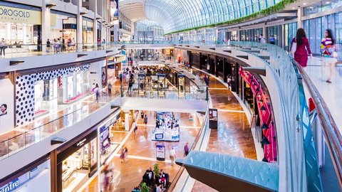 SINGAPORE - August 23: Timelapse in motion - inside view in the shopping mall "The Shoppe" at Marina Bay Sands on August 23, 2017 in Singapore.