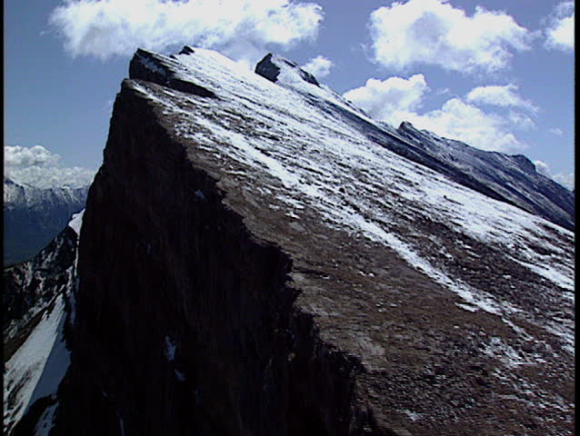 Fly up Sharp Mountain Ridge Stock Footage Video (100% Royalty free