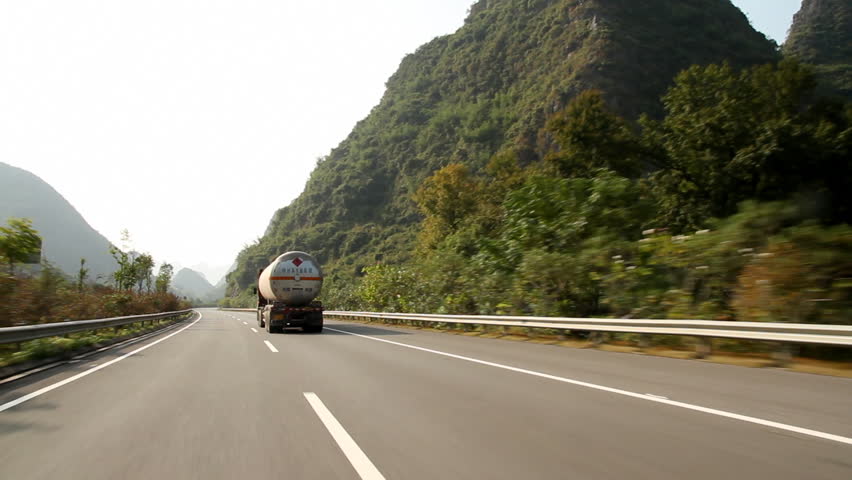 GUILIN, GUANGXI PROVINCE, CHINA - OCTOBER 18: Car fast driving on Guilin highway