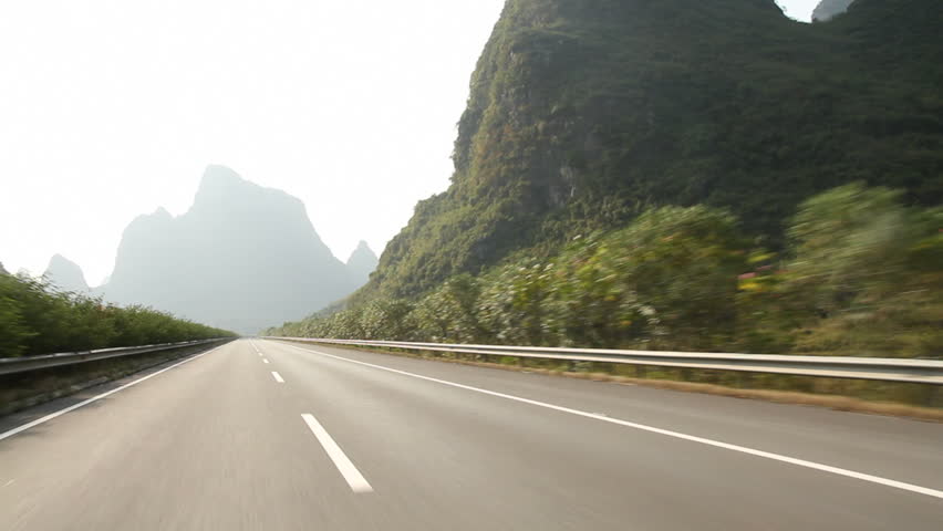 Time lapse of car fast driving on Guilin highway - Guilin, Guangxi Province,