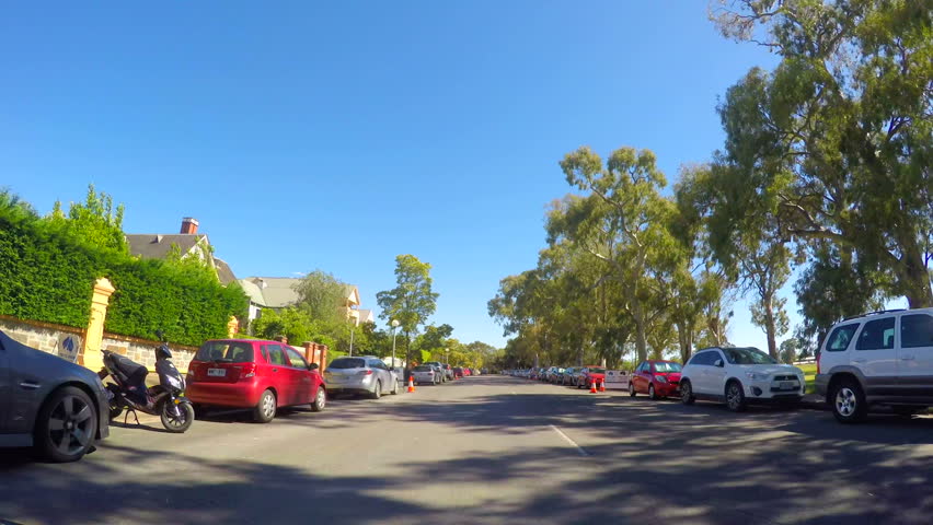 Adelaide City, South Australia, vehicle POV driving along East Terrace past the parklands and South East Corner residential area, time lapse.
