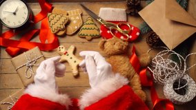 Video of Santa Claus hands preparing gifts for Christmas