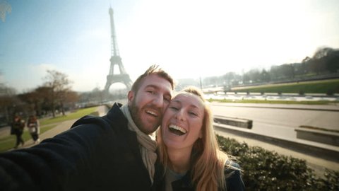 Happy couple in Paris taking selfie-Eiffel tower
Happy cheerful couple in Paris in front of the Eiffel tower on the Champs de Mars taking a selfie using a mobile phone.