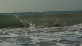 Strong waves at South China Sea on the Dadonghai Beach slow motion stock footage video