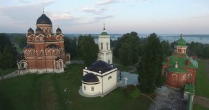 4K aerial video footage view of old beautiful 1812 war military memorial, Spaso-Borodinski monastery, green fields around it in Borodino 120 km west of Moscow, capital of Russia on summer morning