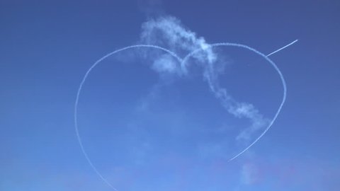 Aerobatic Team draws Heart shape in the sky during airshow