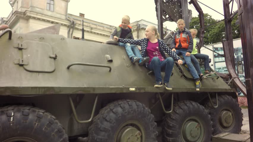 Children in the infantry fighting vehicle. War in Ukraine. Military Armored Personnel Carrier