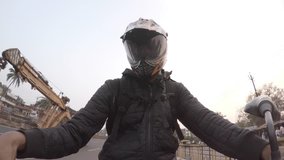 A time lapse of a bike rider riding on the national Highway in India.