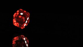 One red dice in a super slow motion rebounding against a black background - Powered by Shutterstock - Get 15% off with code: PIKWIZARD15