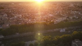 rome aerial shot sun rising over city center flying forward