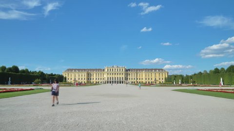 Vienna,01/08/2017: tourists at schonbrunn palace hyperlapse walking through garden
