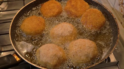preparing fried Rice Balls - turn in the frying pan 4K
