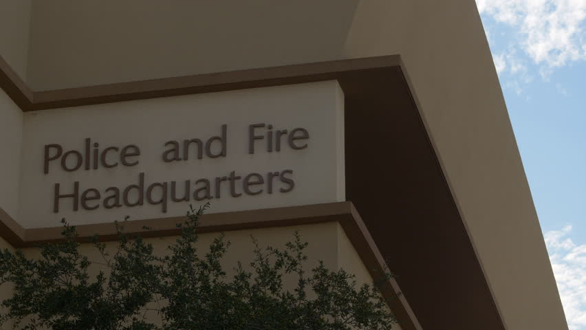 POLICE AND FIRE HEADQUARTERS ESTABLISHING SHOT.  Lock off, close up of generic exterior signage.  Shot in 4K, 10 bit, 4:2:2.