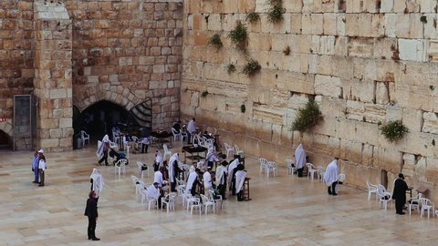 Western Wall or Wailing Wall or Kotel in Jerusalem. People come to pray to the Jerusalem western wall. The Wall is the most sacred place for all jews in the world.