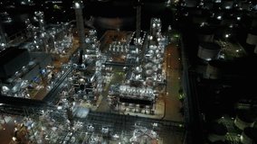 4K Night aerial view around oil refinery