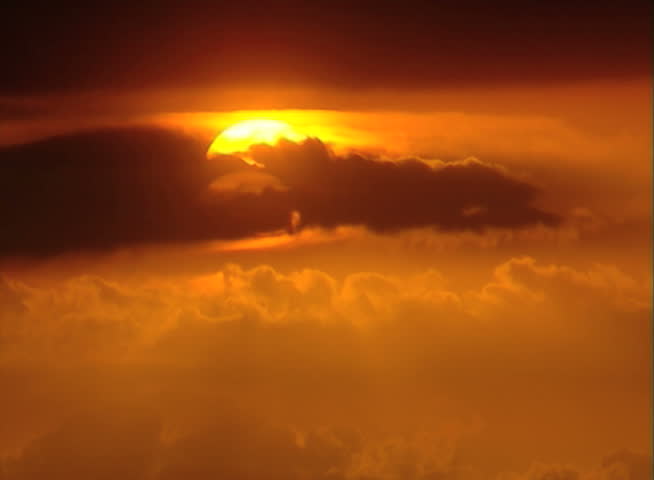 Beautiful Sunset time-lapse through clouds. Sun close up, 