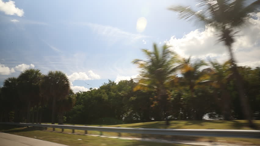 Looking out of a driving car on a sunny day in Miami, USA