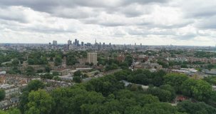Aerial approaching view of the skyline of central London from a park