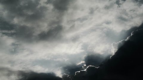 4K Time lapse of clouds movement in sky with sun ray 