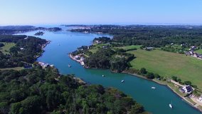 Flying over the Mill of the lake, an old tide mill located on the Crac'h river at Carnac, Morbihan, Bretagne, France. Carnac is well-known for its famous rows of standing stones.