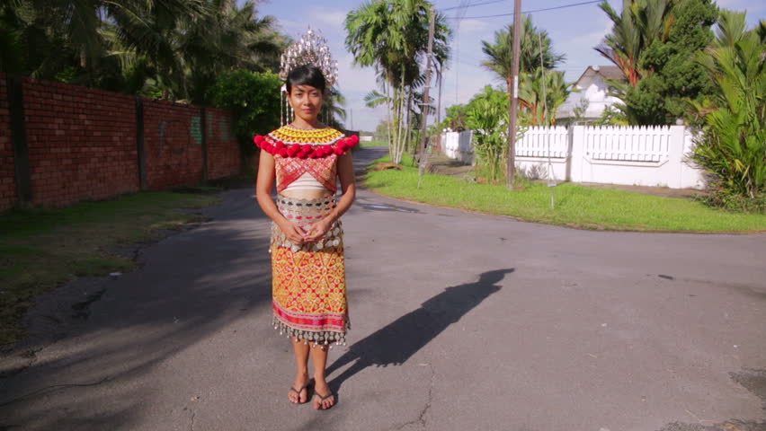 Iban tribal woman with traditional clothes shot in the daylight