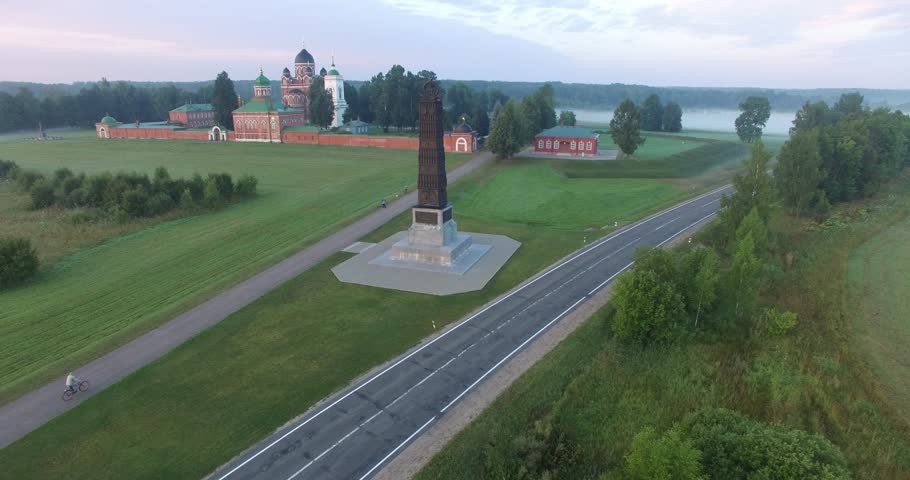 4K aerial video footage view of old beautiful 1812 war military memorial, Spaso-Borodinski monastery, green fields around it in Borodino 120 km west of Moscow, capital of Russia on summer morning
