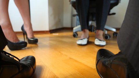 Legs under desk Stock Video Footage - 4K and HD Video Clips | Shutterstock