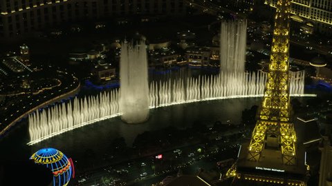 Las Vegas - May 2017: Aerial illuminated night view of Las Vegas Strip Bellagio Fountains Eiffel Tower Resort Hotels and city Casinos Nevada USA RED WEAPON