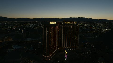 Las Vegas - May 2017: Aerial illuminated sunset dusk view of Las Vegas Strip Resort Hotels and Casinos city suburbs Nevada USA RED WEAPON