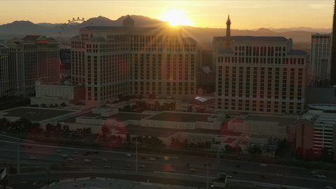 Las Vegas - May 2017: Aerial sun flare view at sunset of Bellagio luxury Resort Hotel and Casino Highway travel destination Nevada USA RED WEAPON