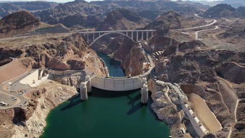 Aerial view Hoover Dam on US 93 tourist destination with Colorado River Bypass bridge and Lake Mead Nevada Arizona America RED WEAPON