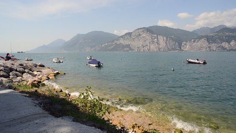Malcesine, Lake Garda, Italy - August 18, 2017: Boats moored along Lake Garda in Malcesine - Italy