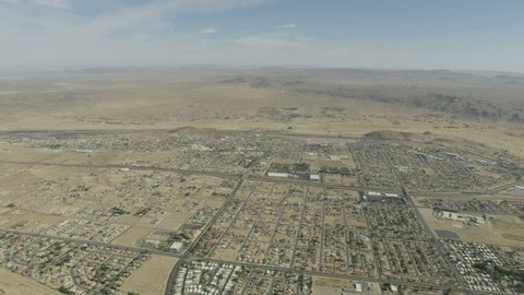 Aerial view of Barstow community a residential city of homes and commercial property community Mojave desert California USA RED WEAPON