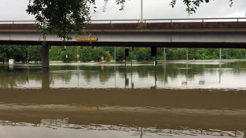 Water has completely flooded an underpass and is now flowing into Buffalo Bayou after Hurricane Harvey.